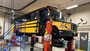 School Bus on a lift for repairs