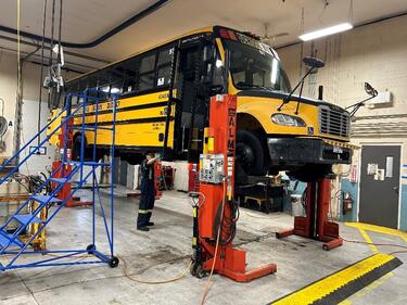 School Bus on a lift for repairs